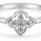 Detailed product-only crop of the white gold plated quatrefoil moissanite ring setting and band.