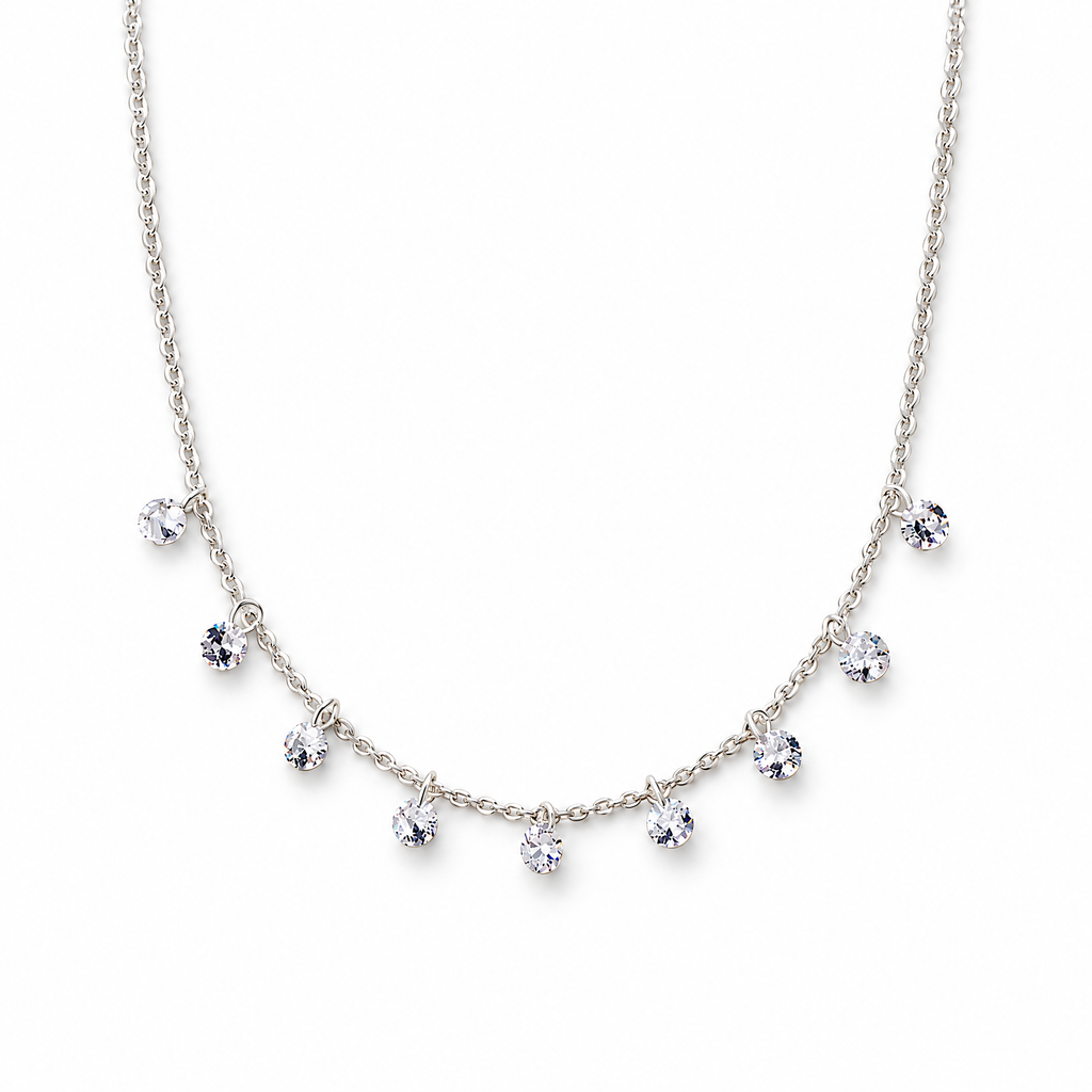 The Astrid CZ Link Necklace — silver-tone CZ charm necklace, full-necklace white studio view; reference-based AI visualization.