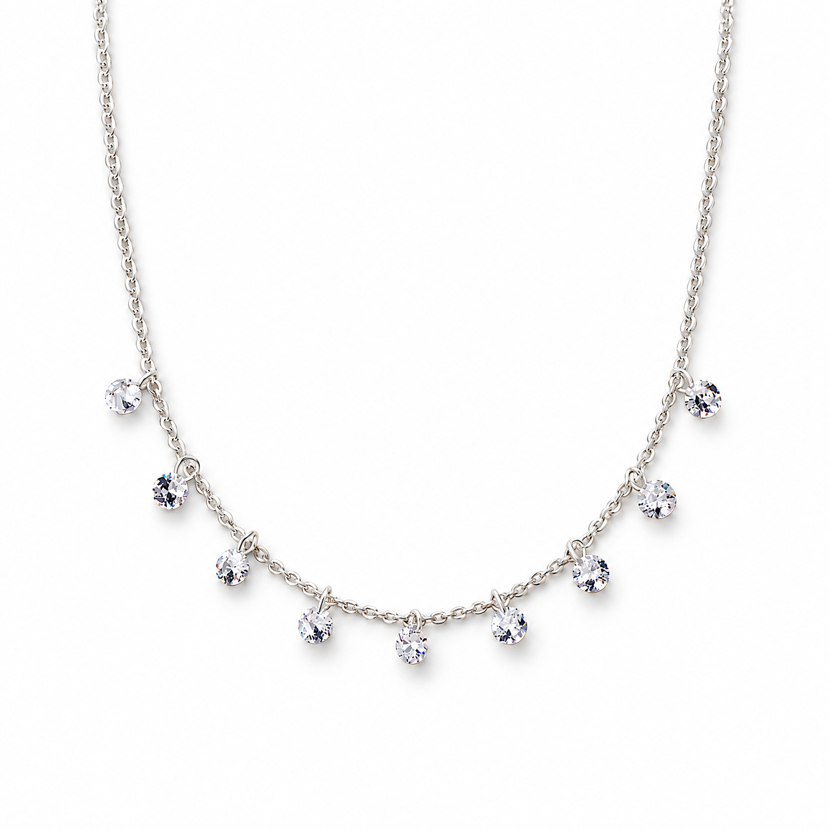 The Astrid CZ Link Necklace — silver-tone CZ charm necklace, full-necklace white studio view; reference-based AI visualization.