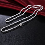 Unchanged original supplier image of The Gala Twisted Rope Chain Necklace showing 925 on the round tag beside the lobster clasp.