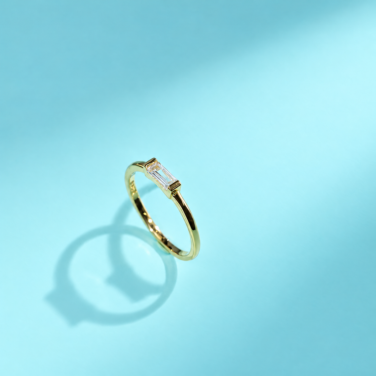 The Lyra Emerald-Cut Statement Ring — Genuine two-second oblique video angle; AI-enhanced supplier view