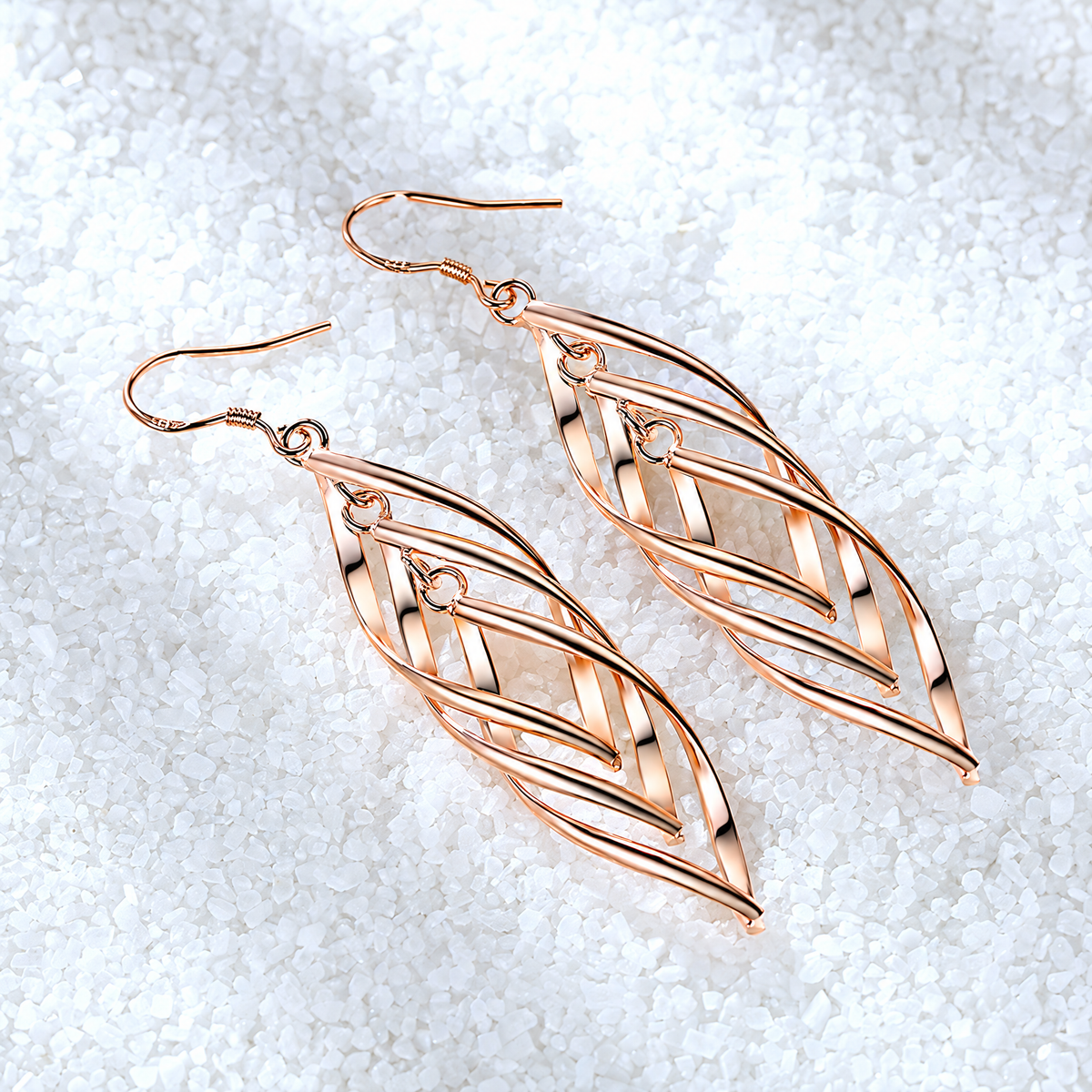 The Sova Drop Earrings — Overhead diagonal flat lay; AI-enhanced supplier view