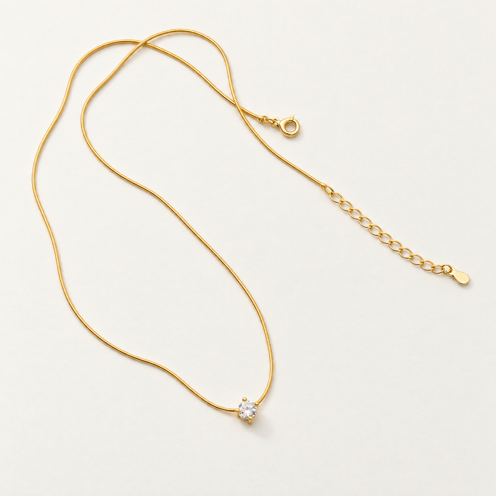 The Elora CZ Pendant — full chain and closure flat lay; reference-based AI visualization