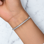The Maia Pavé Hinge Bangle in Sterling Silver worn on the wrist in the supplier’s clasp-side view, showing the pavé-set cubic zirconia line and hinge clasp.