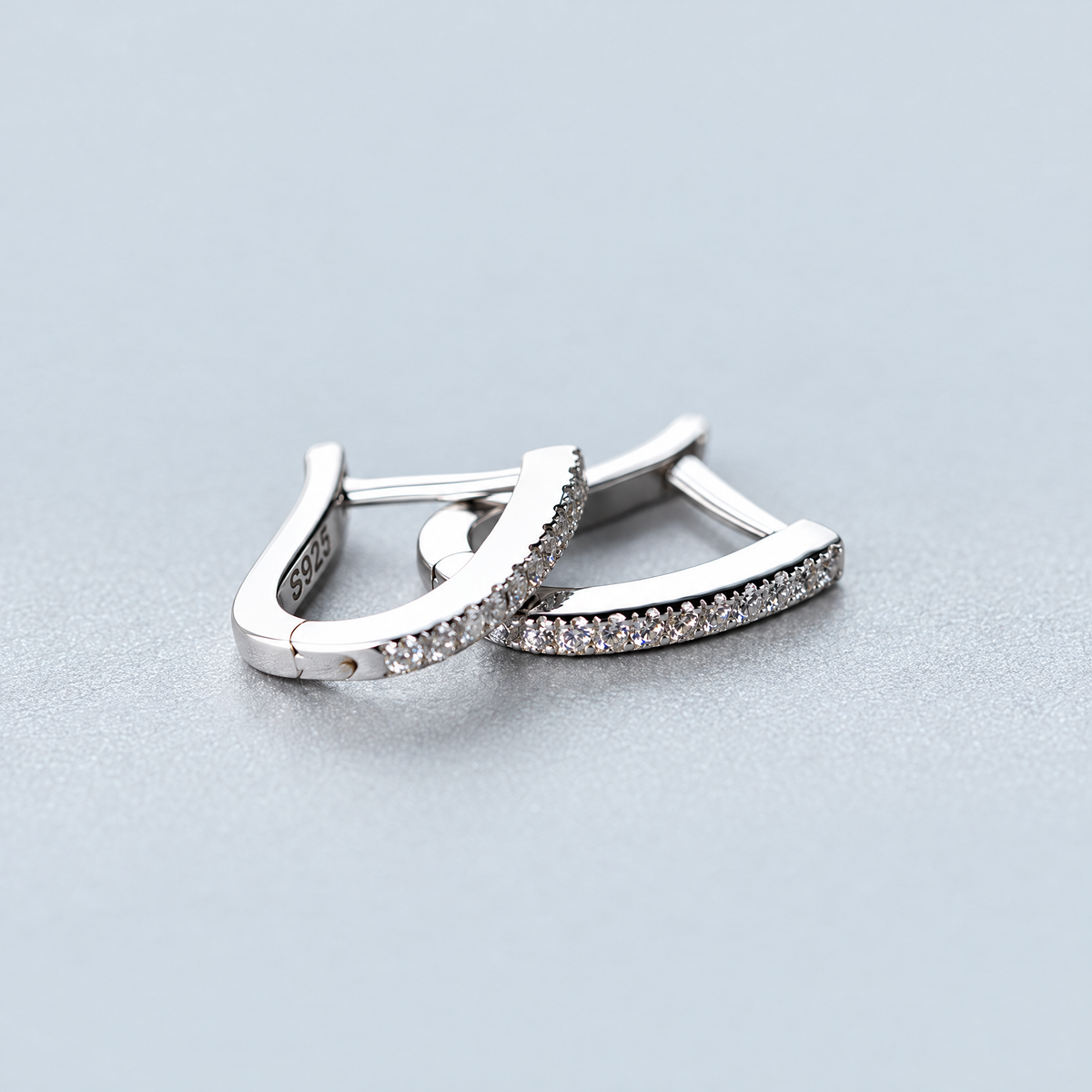 The Aria CZ Hoops — Overlapping pair, elevated side/top detail; AI-enhanced supplier view