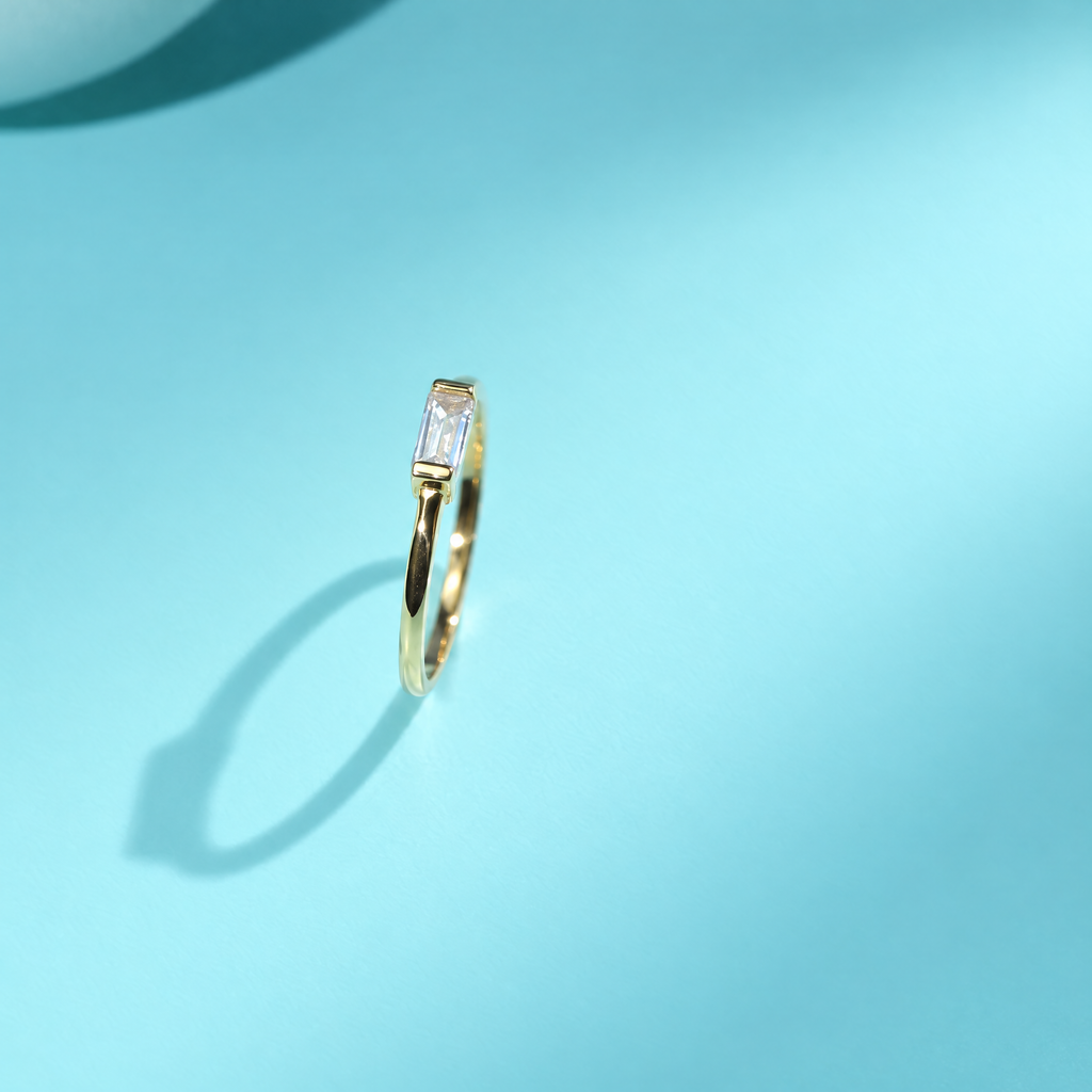 The Lyra Emerald-Cut Statement Ring — Genuine five-second upright video angle; AI-enhanced supplier view