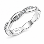 The Veda CZ Twisted Band — primary angled white-studio view with soft shadow; studio-white edit and AI enhancement of the inherited AI-enhanced supplier view, not independently photographed jewelry.
