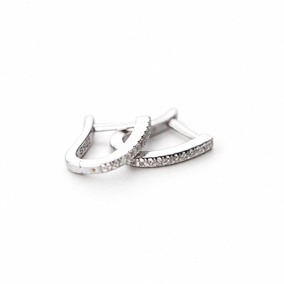 The Aria CZ Hoops — overlapping pair, elevated side/top detail on a white studio background.