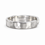 The Lena Hammered Open Band Ring in 925 sterling silver, front exterior view with white-studio lighting.