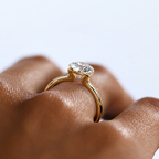Astrea gold-tone moissanite solitaire ring — opposite-side worn view; AI-enhanced supplier view