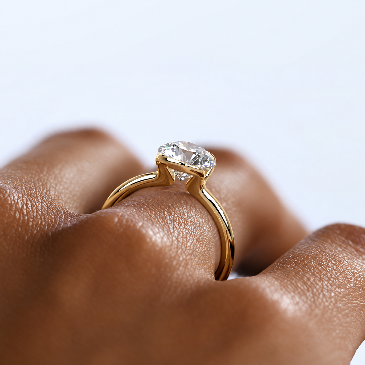 Astrea gold-tone moissanite solitaire ring — opposite-side worn view; AI-enhanced supplier view