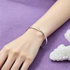 The Talo Open Cuff Bangle — On-wrist wear view; AI-enhanced supplier view