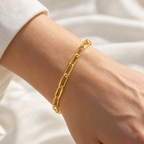 The Linnea Link Bracelet — Gold bracelet close wrist detail — reference-based visualization; reference-based AI visualization