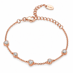 Rose Gold Plated 925 sterling silver bracelet with five pavé CZ heart and round stations, lobster clasp and extension chain on white.