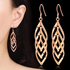 The Sova Drop Earrings — On-ear scale view with matching pair; AI-enhanced supplier view