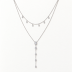 The Lyra Y-Drop Lariat — Silver full flat-lay close view; reference-based AI visualization