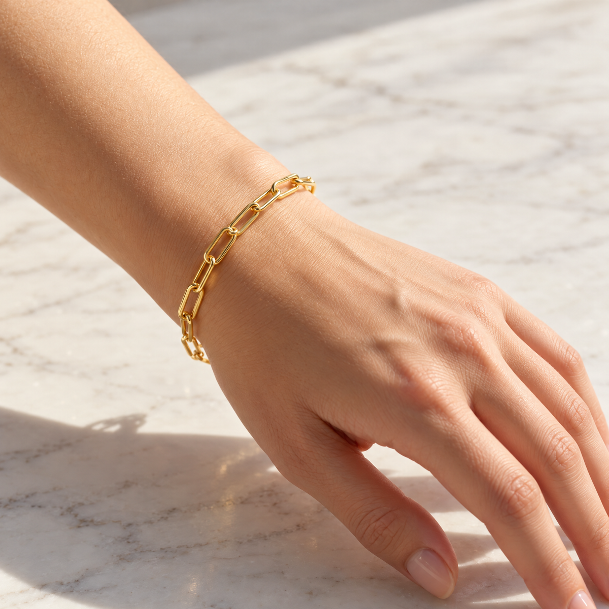 The Linnea Link Bracelet — Gold bracelet full on-wrist view — reference-based visualization; reference-based AI visualization