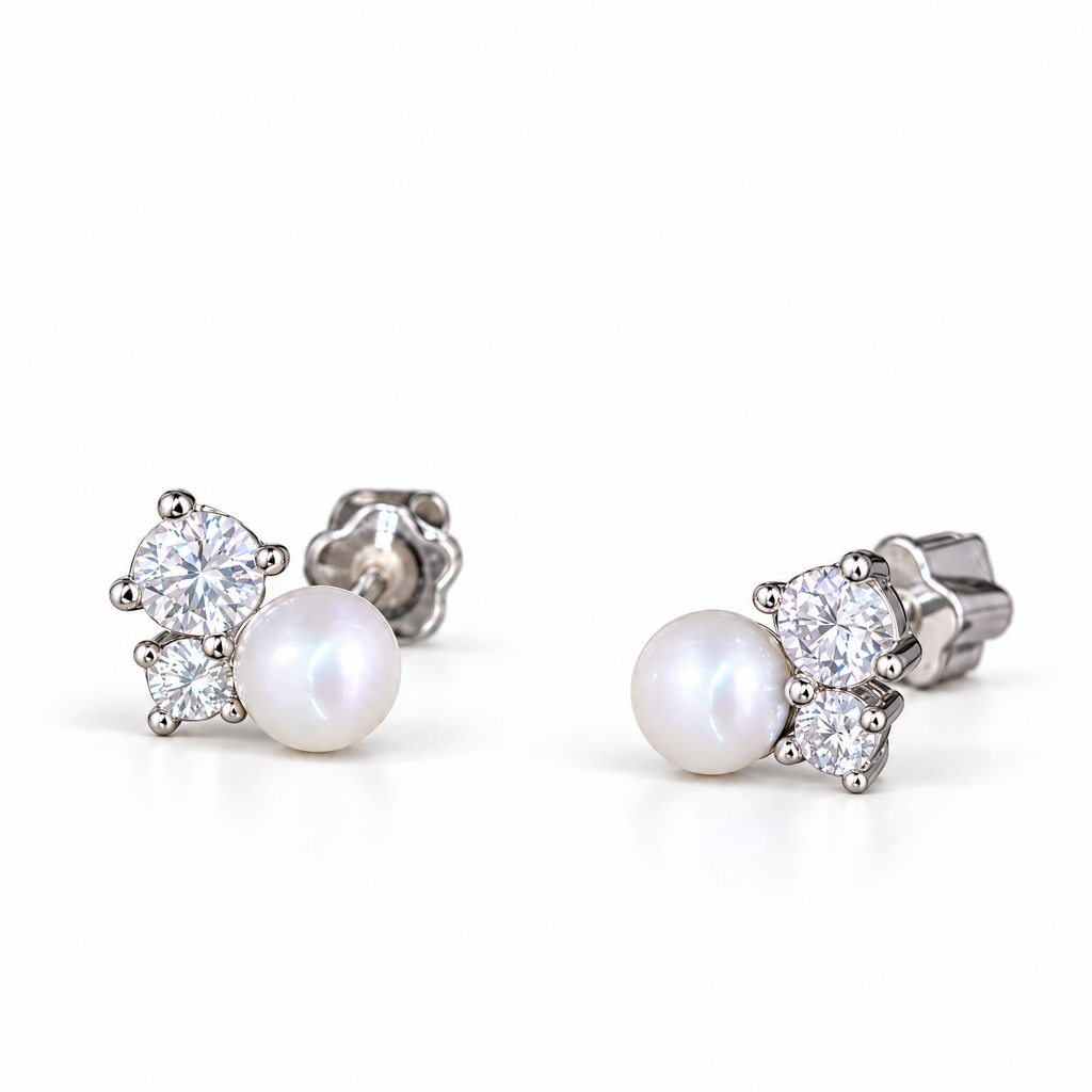 A pair of asymmetric 925 sterling silver stud earrings with pearl decoration and moissanite details, shown from the front on a white studio background.