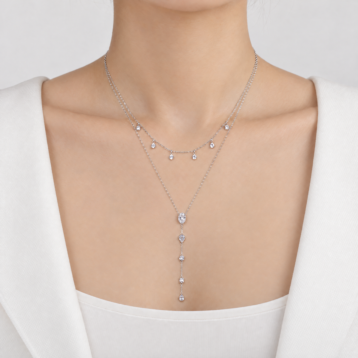 The Lyra Y-Drop Lariat — Silver on-body front view — correct main setting; reference-based AI visualization