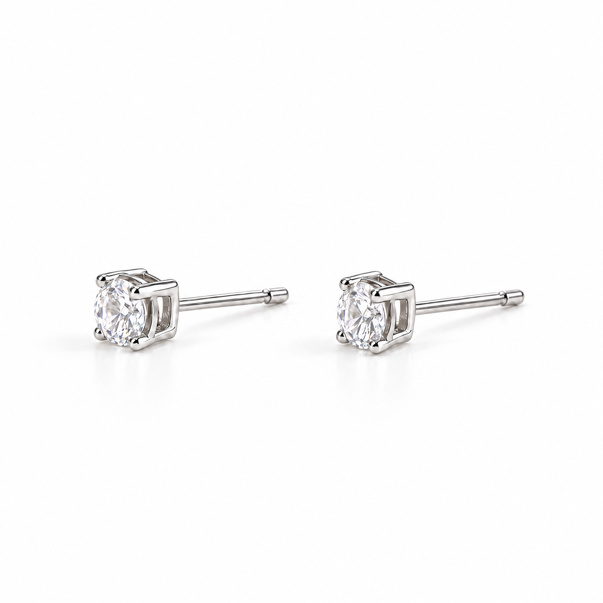 The Neva CZ Stud Earrings — silver-tone side-profile pair view in a white studio with soft contact shadows; studio edit and AI enhancement of the existing reference-based AI visualization.