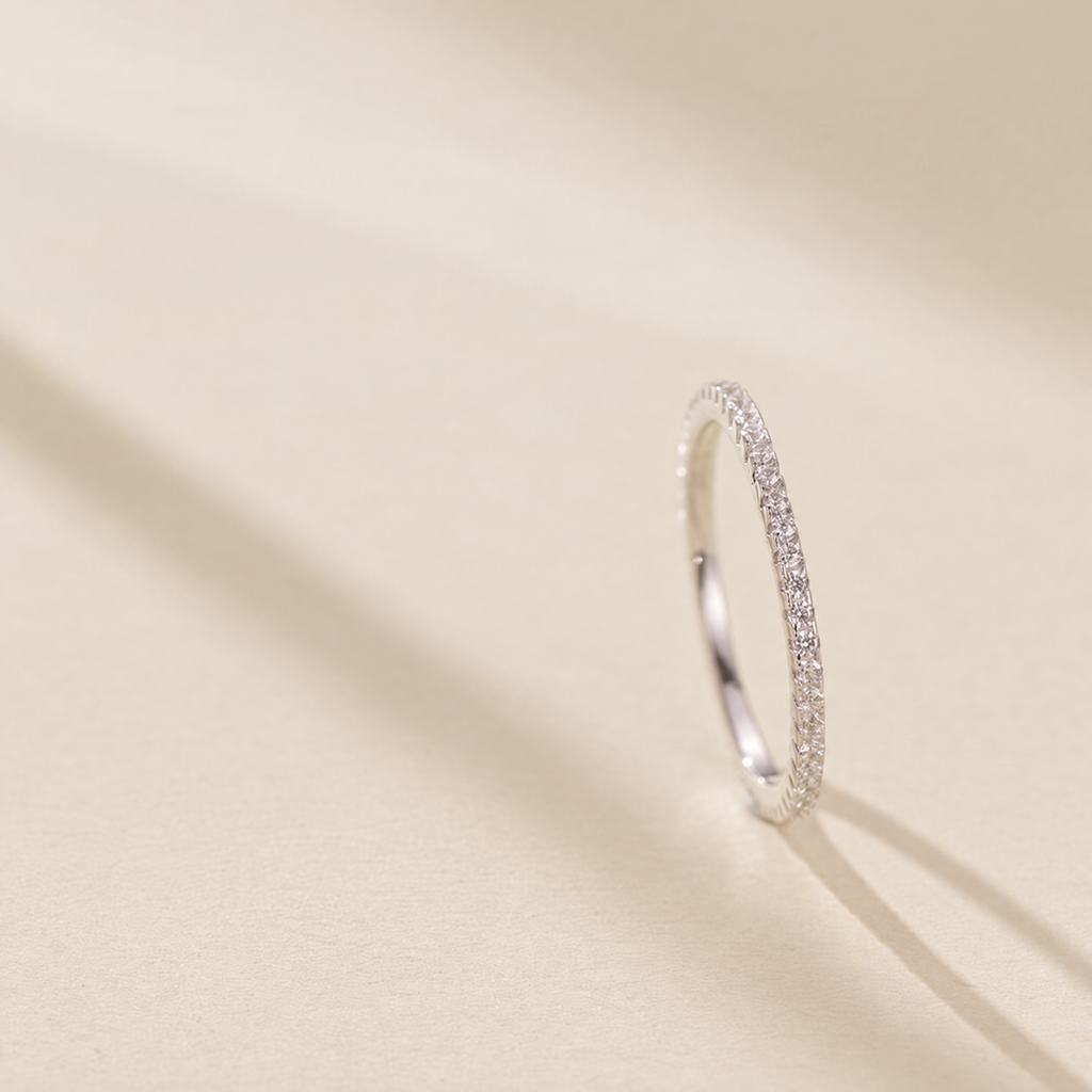 The Vale Eternity Band — upright side-on cream-studio; AI-enhanced supplier view