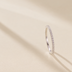 The Vale Eternity Band — upright side-on cream-studio; AI-enhanced supplier view