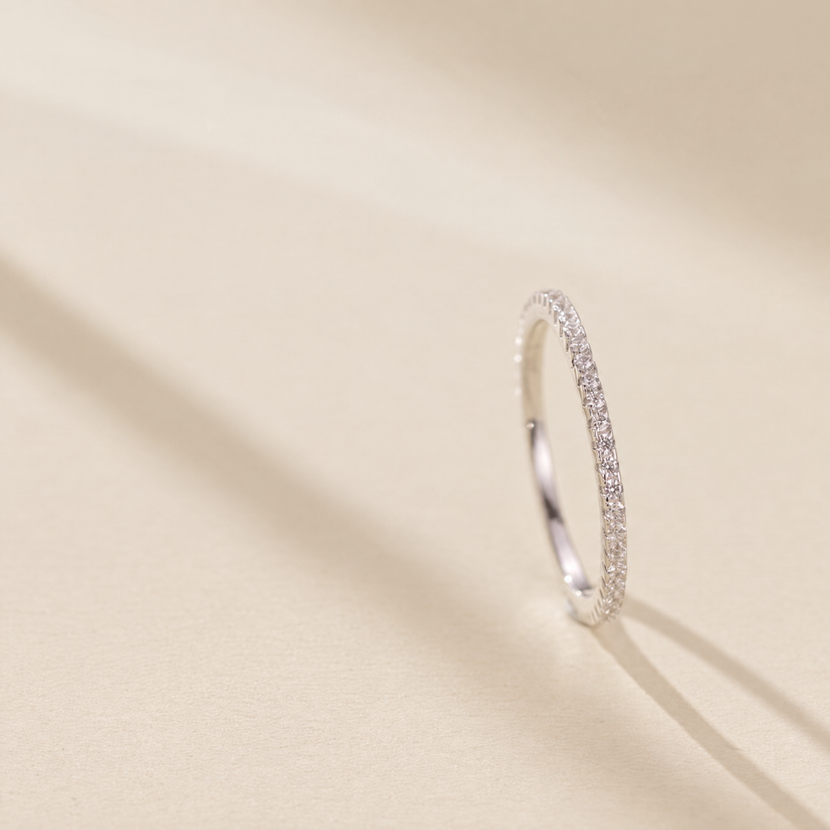 The Vale Eternity Band — upright side-on cream-studio; AI-enhanced supplier view