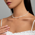 The Vesper Freshwater Pearl Strand — On-body neckline view; AI-enhanced supplier view