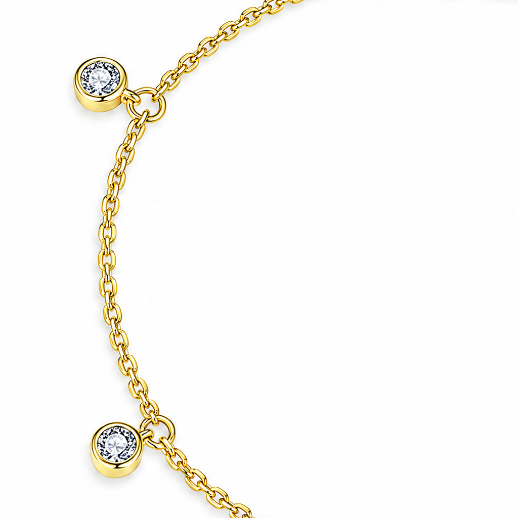 Gold Tone Helle Moissanite Station Bracelet detail crop showing two round bezel stations and connecting chain on white.
