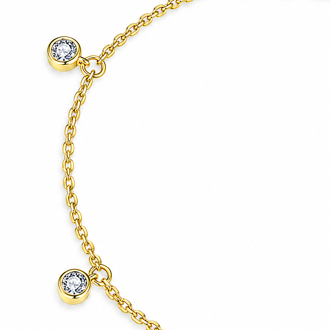 Gold Tone Helle Moissanite Station Bracelet detail crop showing two round bezel stations and connecting chain on white.