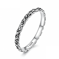 Product macro of the Sterling Silver engraved scroll band with its S925 inner-band mark visible.