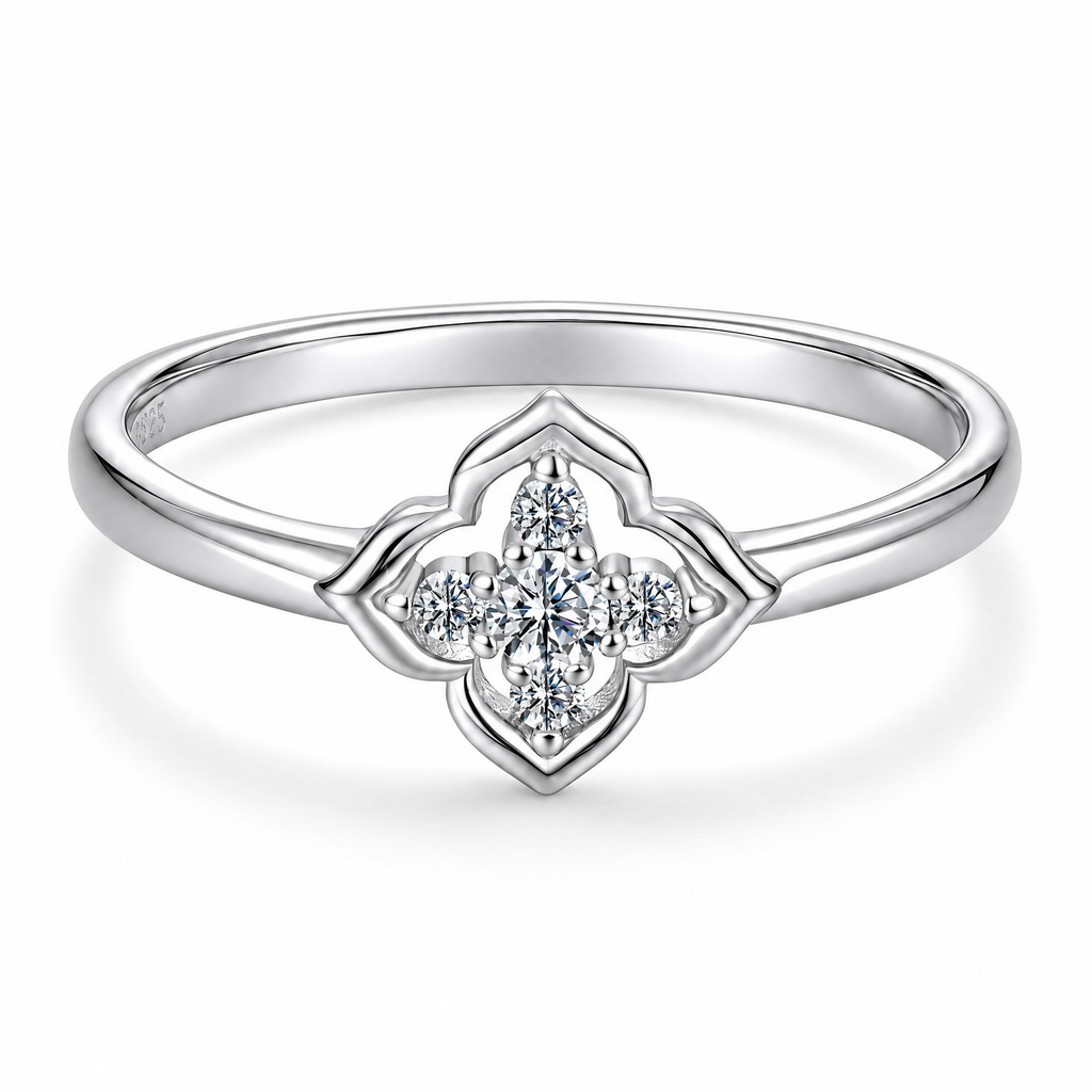 Clean white studio macro derivative of the four-lobed quatrefoil moissanite ring, preserving the front source angle and visible inner-band S925 hallmark.