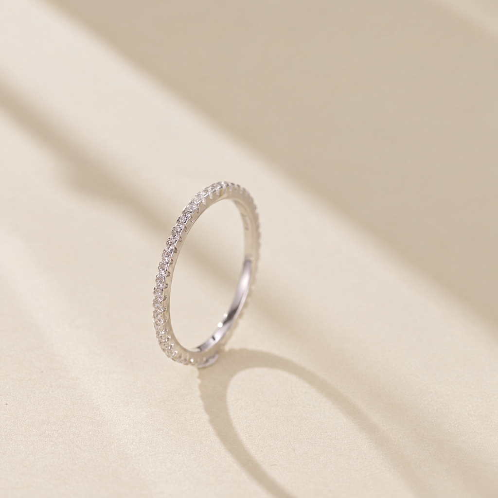 The Vale Eternity Band — upright cream-studio three-quarter; AI-enhanced supplier view