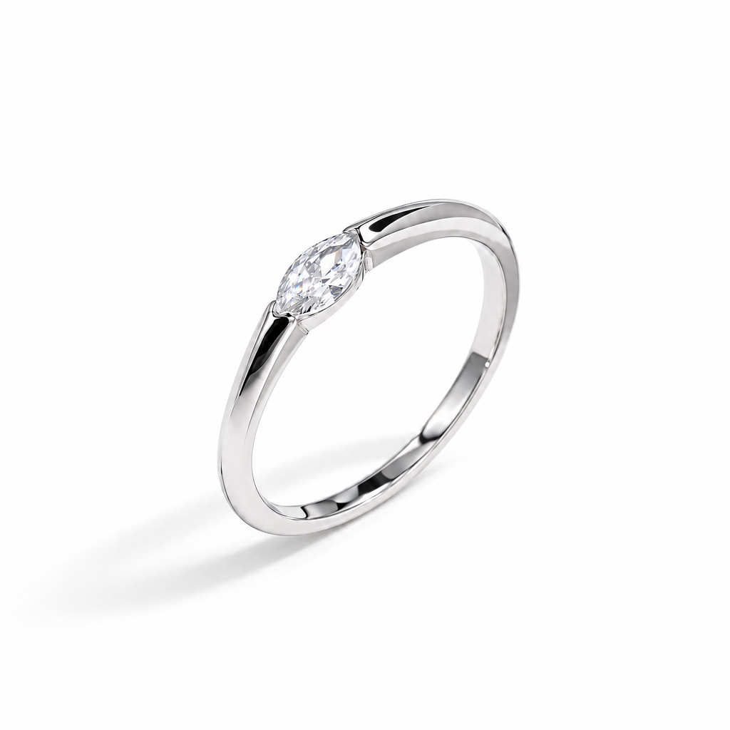 The Aure Marquise-Cut CZ Ring in sterling silver, side view with white-studio lighting.