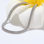 Silver-tone 3.0 mm mesh bracelet draped over a white flower in the actual supplier camera view, with only surrounding framing cropped.