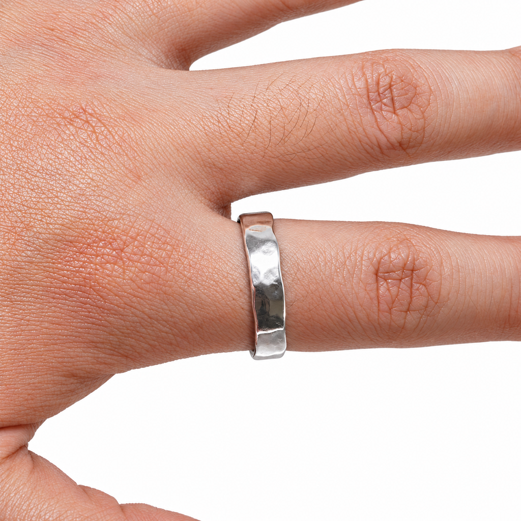 The Lena Hammered Open Band Ring in 925 sterling silver, worn view with white-studio lighting.