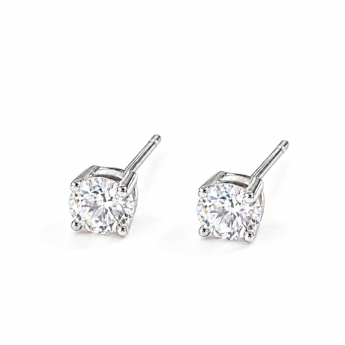 The Neva CZ Stud Earrings — silver-tone three-quarter pair view in a white studio with soft contact shadows; studio edit and AI enhancement of the existing reference-based AI visualization.