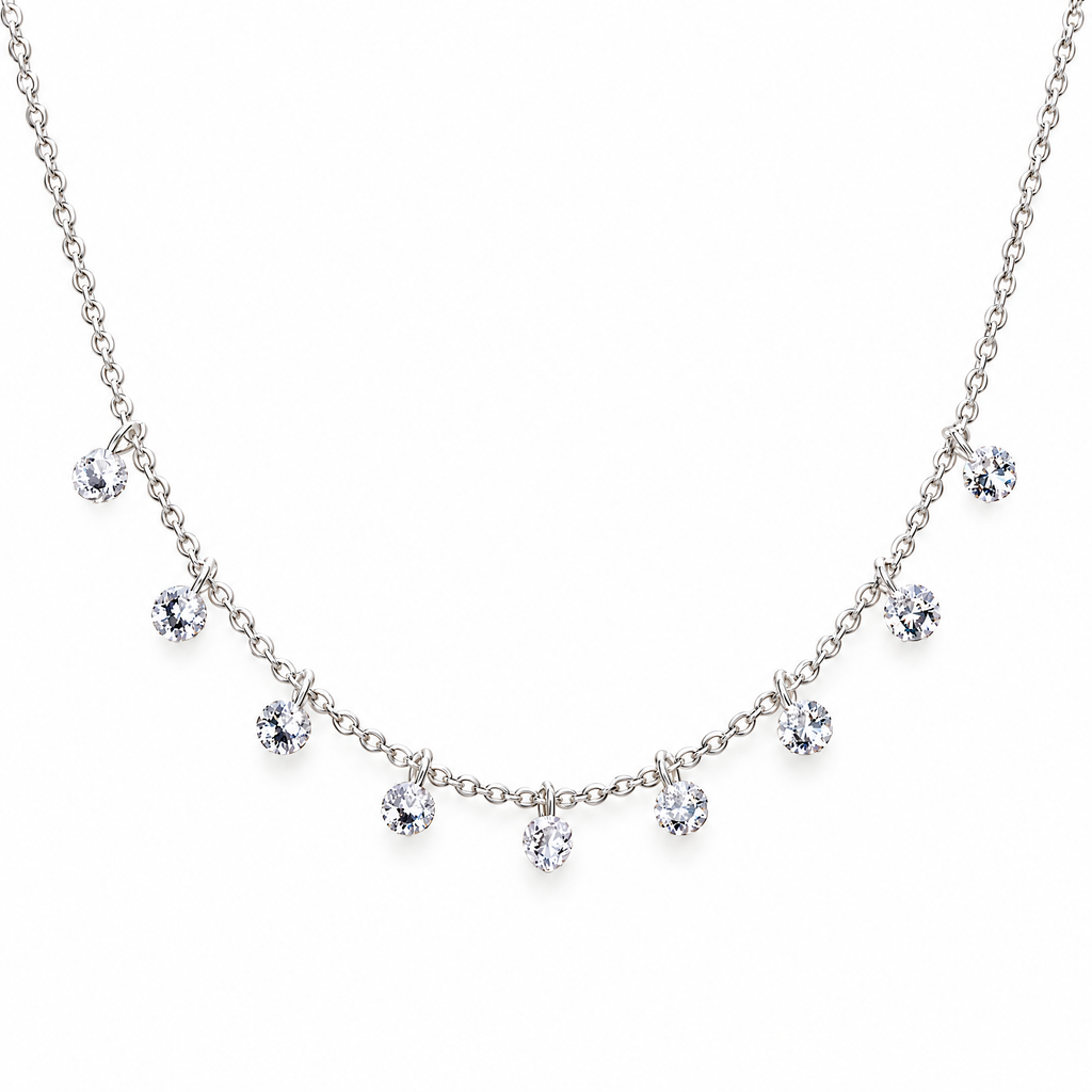 The Astrid CZ Link Necklace — silver-tone CZ charm necklace, front detail in white studio; reference-based AI visualization.